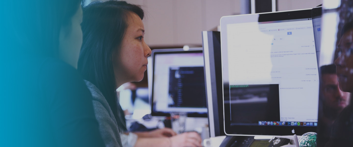 girls looking deployment system on computer